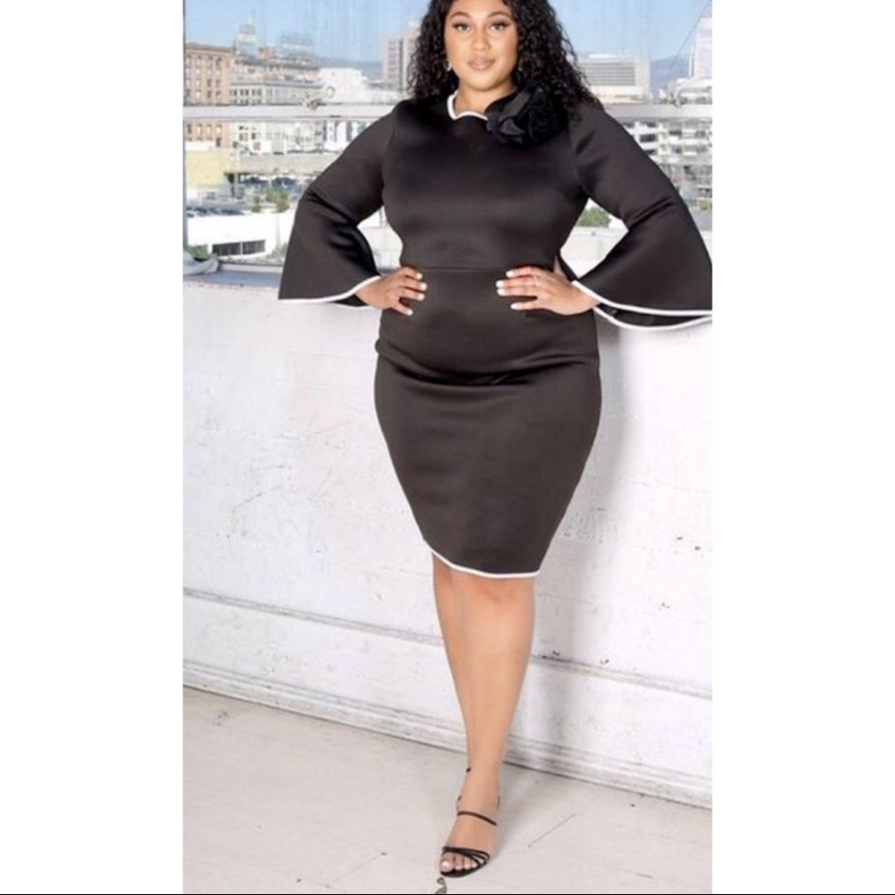 Midi Black dress with white trim detail.